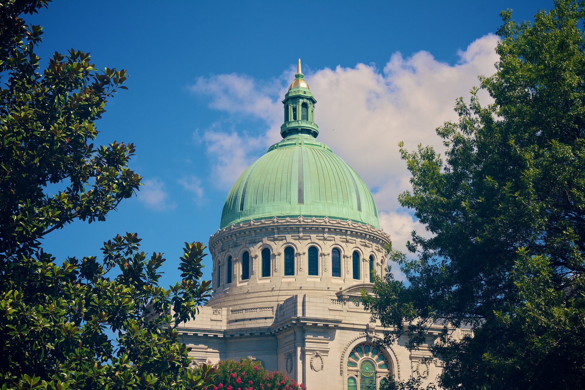 A green dome on top of a building.