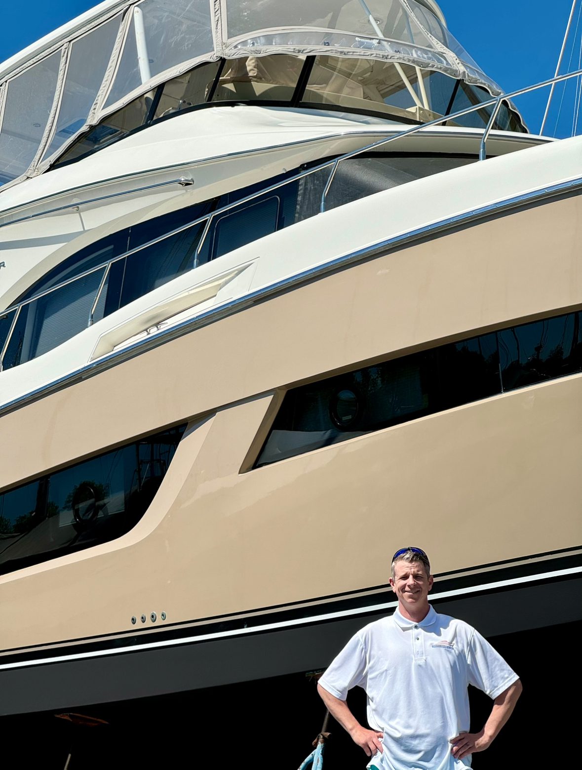 IMG_1384 A man standing in front of a large boat.