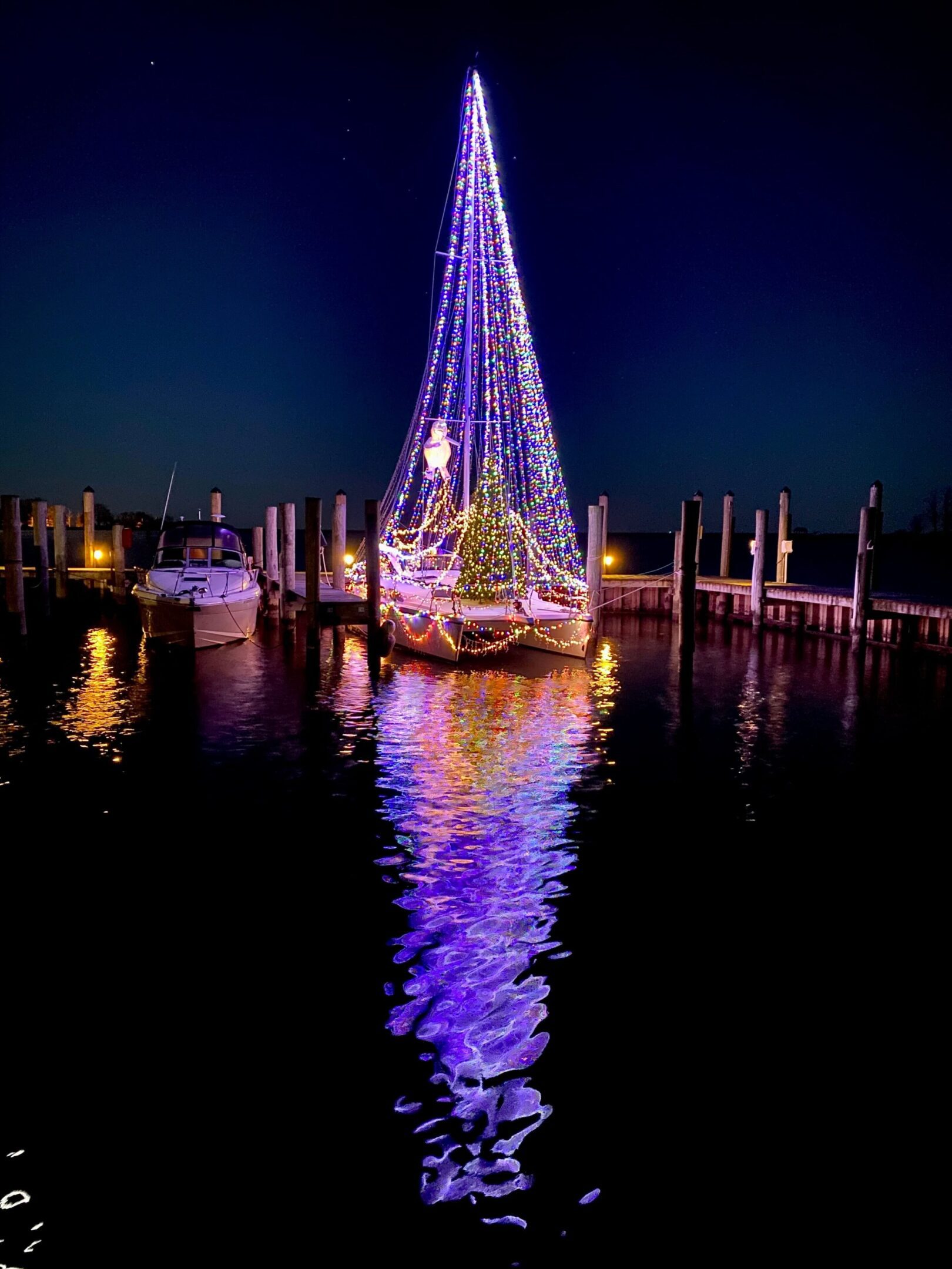 A boat with lights on it in the water.