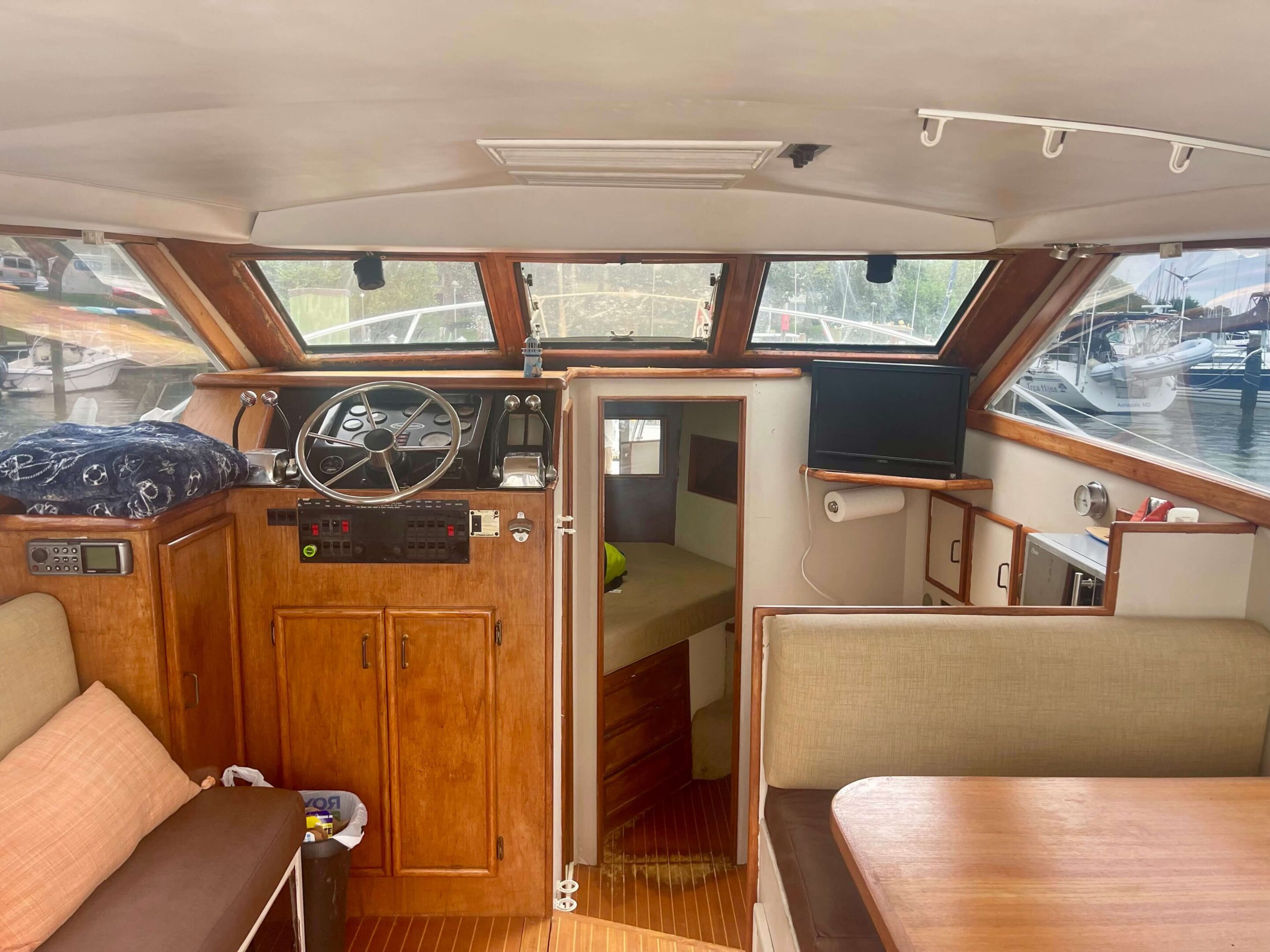 IMG_3211 A boat with wood trim and wooden cabinets.