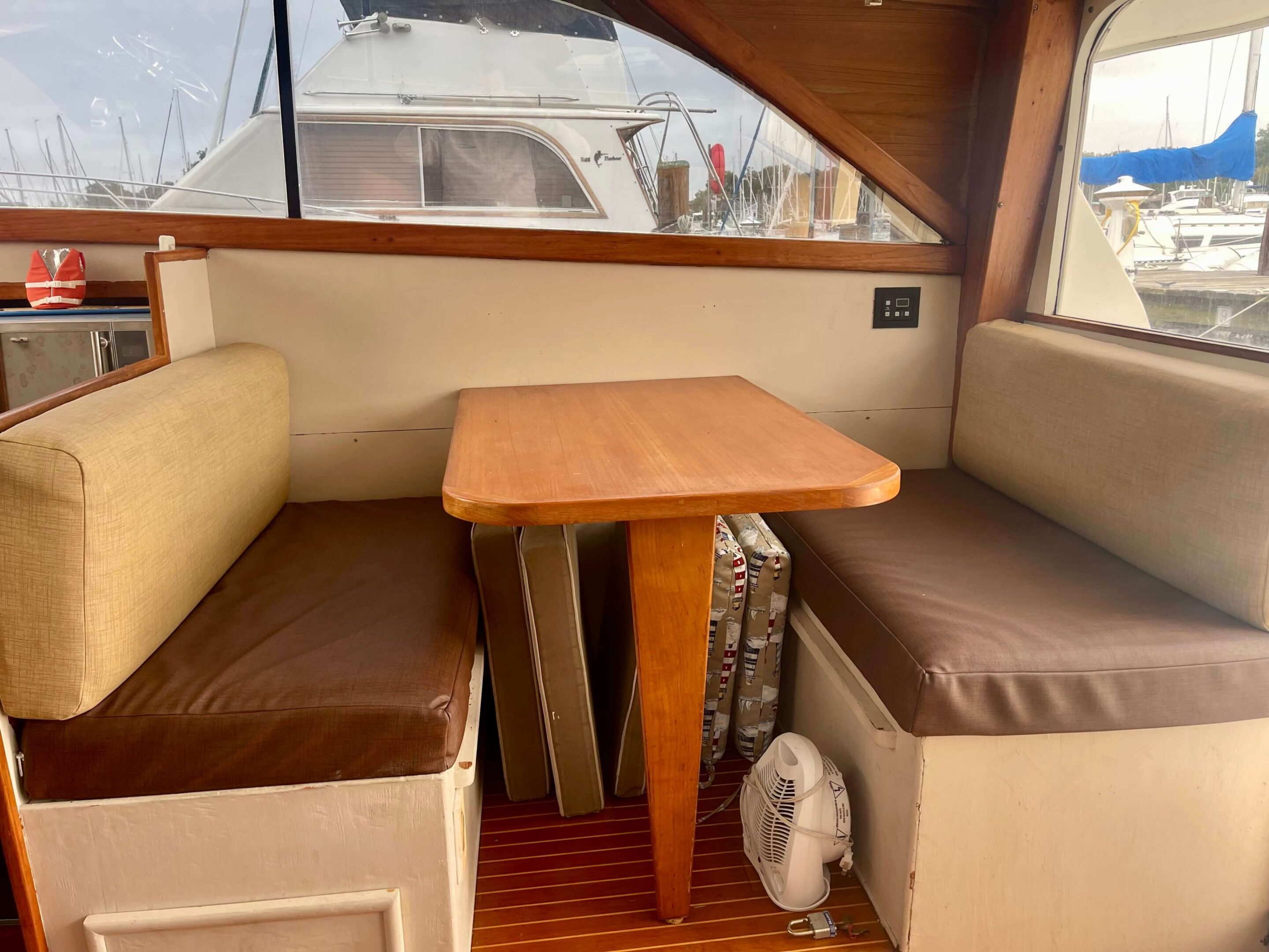 IMG_3215 A table and bench in the back of a boat.