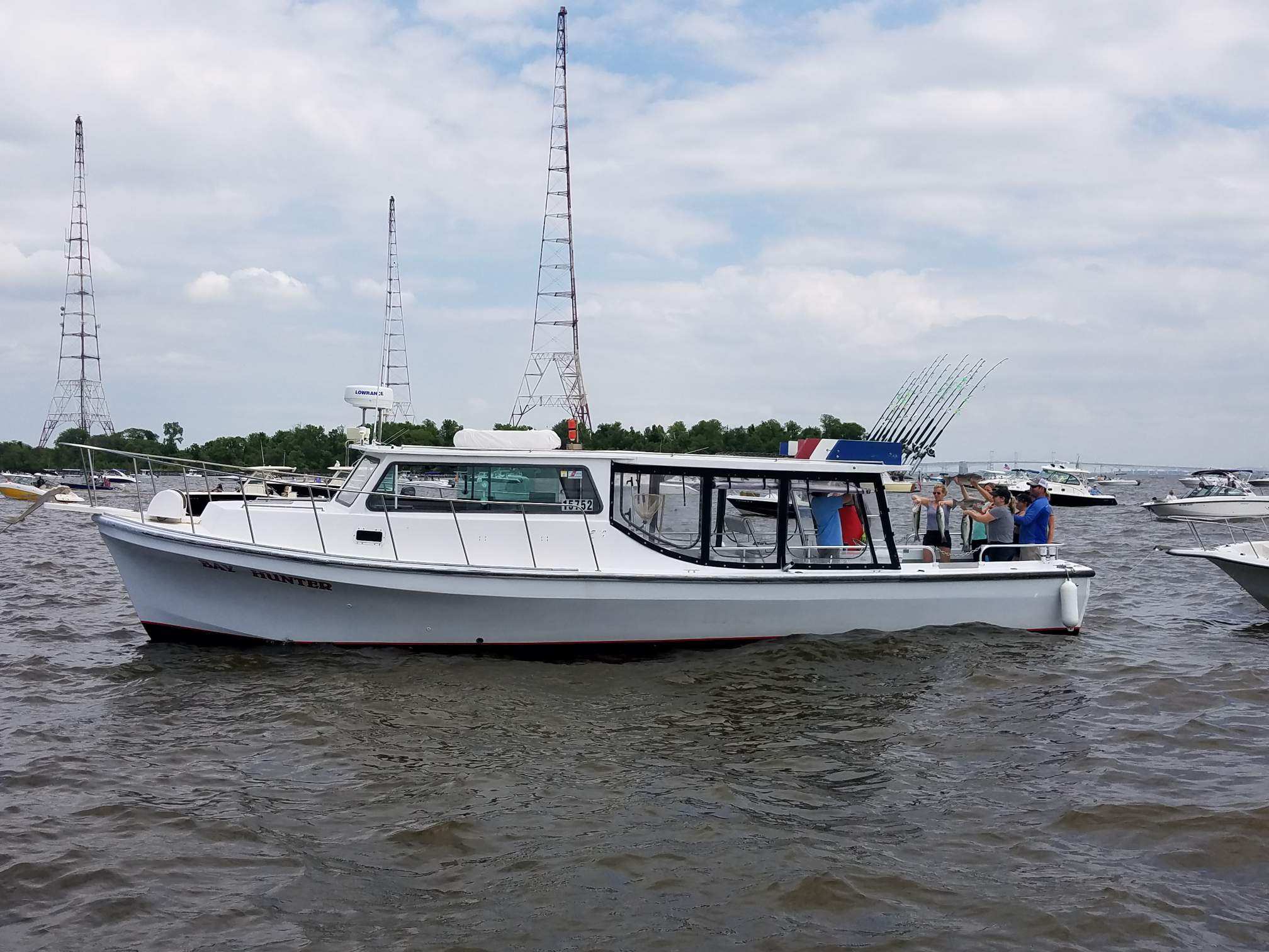 A boat with people on it in the water.