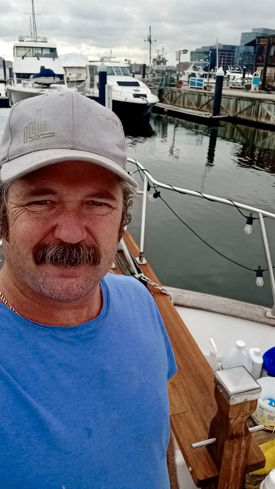 image000000-6 A man with a beard and hat on a boat.