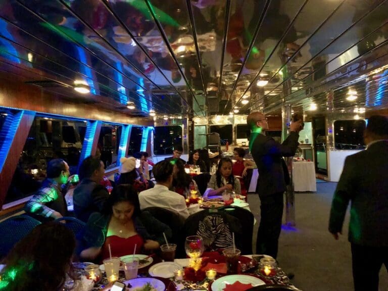 Lively dinner cruise with colorful party lights